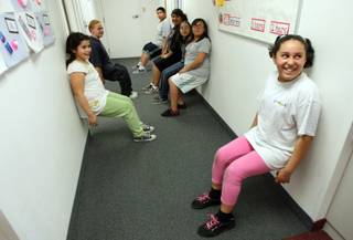 Jocelin Anguiano, right, 10, and other students try to outlast each other as they 