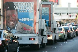Mobile billboards sit in traffic on the Strip on Tuesday, March 24, 2009. 