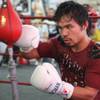Photo: Manny Pacquiao hits a double-end bag as prepares f Photo: Manny Pacquiao hits a double-end bag as prepares f