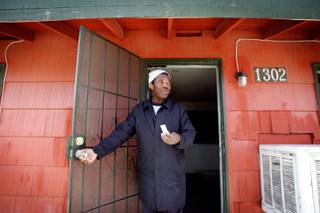 Clarence Rowles, who pays his rent with Clark County's rental assistance program, stands inside his apartment during a visit from a Las Vegas code enforcement inspector Wednesday, April 1, 2009. In addition to many other code violations in his apartment, Las Vegas inspectors found the apartment overfilled by the landlord with people on Clark County's rental assistance program. Rowles was the only tenant allowed to stay in the unit. 