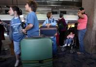 McDoniel fifth graders wait at McCarran Airport Friday as they head out to Costa Rica for spring break as a finale to their six years of Spanish immersion education.

