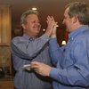 Cam Walker receives a high five from his brother-in-law, Doug Broadbent, left, after the announcement that Walker received the most votes in the early voting of the primary election for a seat on the Boulder City Council during his watch party Tuesday night at Kirk and Vivian Harrison's home. Cam Walker receives a high five from his brother-in-law, Doug Broadbent, left, after the announcement that Walker received the most votes in the early voting of the primary election for a seat on the Boulder City Council during his watch party Tuesday night at Kirk and Vivian Harrison's home.