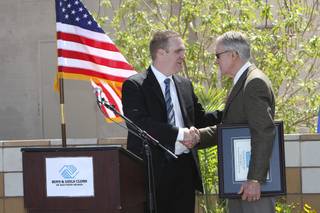 Club alumnus D.J. Allen, left, presents Sen. Harry Reid with a lifetime membership card to the Boys & Girls Club Thursday during the grand opening ceremony of the John C. Kish Boys & Girls Club in Henderson.