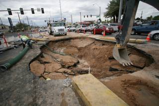 Crews work at the site of a water main break on East Sahara Avenue near Nellis Boulevard.