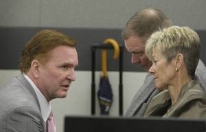 Lead attorney Robert Eglet, left, speaks with Henry Chanin, headmaster of the Meadows School, and wife Lorraine as they wait for jury selection to begin for an endoscopy trial at the Regional Justice Center Monday, April 12, 2010. Chanin is suing Teva Parenteral Medicines alleging strict product liability and negligence, resulting in Henry Chanin contracting Hepatitis C from exposure to contaminated vials of Propofol. Other defendants previously included in the lawsuit have settled.