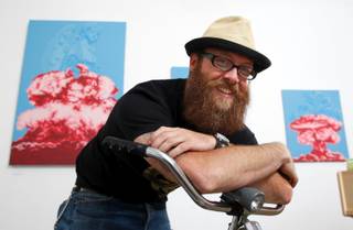 JW Caldwell poses with his artwork in the Trifecta Gallery in the Arts Factory located at 107 E. Charleston Blvd., Thursday, April 16, 2009. In the background are a series entitled 