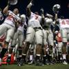 Photo: Players sing the UNLV school song after the team's Photo: Players sing the UNLV school song after the team's
