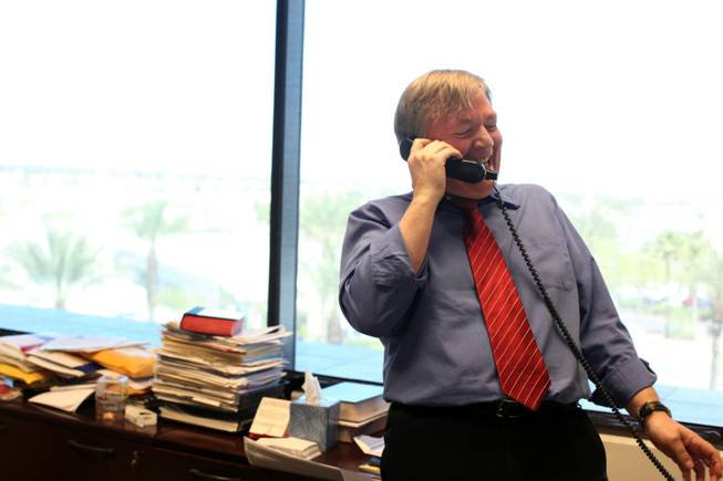 Deputy managing editor Drex Heikes spreads word Monday of the Las Vegas Sun's win of the Pulitzer Prize for public service for exposing a high death rate among construction workers on the Las Vegas Strip.