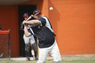 Chaparral coach Todd Faranda warms up his team before the Cowboys' game against Las Vegas High on Apr. 23.