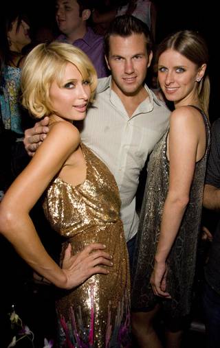 Paris Hilton, Doug Reinhardt and Nicky Hilton at Tao on April 25.