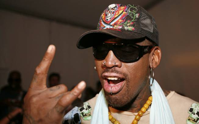 Former NBA basketball player Dennis Rodman poses before the Ed Hardy swimwear runway show in Miami Beach, Fla., on July 19, 2008.