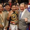 Manny Pacquiao poses after his second round knockout of Ricky Hatton at the MGM Grand Garden Arena in Las Vegas on May 2, 2009. With Pacquio are boxing promoter Bob Arum, second from right, and head trainer Freddie Roach, far right. Manny Pacquiao poses after his second round knockout of Ricky Hatton at the MGM Grand Garden Arena in Las Vegas on May 2, 2009. With Pacquio are boxing promoter Bob Arum, second from right, and head trainer Freddie Roach, far right.