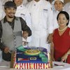 Philippine President Gloria Macapagal Arroyo, right, poses as Filipino boxing star Manny Pacquiao cuts a cake given to him at the Malacanang presidential palace in Manila, Philippines, on Monday. Pacquiao, who stunned Ricky Hatton in the second round of their title fight on May 3 in Las Vegas, was greeted by huge crowds at his homecoming. Philippine President Gloria Macapagal Arroyo, right, poses as Filipino boxing star Manny Pacquiao cuts a cake given to him at the Malacanang presidential palace in Manila, Philippines, on Monday. Pacquiao, who stunned Ricky Hatton in the second round of their title fight on May 3 in Las Vegas, was greeted by huge crowds at his homecoming.