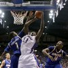 Photo: Kansas' Quintrell Thomas (11) gets past UMKC's Jam Photo: Kansas' Quintrell Thomas (11) gets past UMKC's Jam