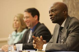 North Las Vegas mayoral candidate William Robinson, right, answers questions during a debate with Shari Buck, left, and moderated by Andrew Martin, center, at the Silver Mesa Community Center on Wednesday.
