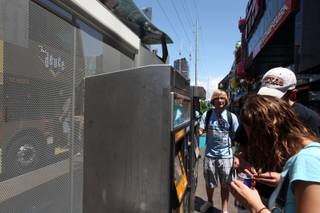 Durango High School senior Colby Laub, 17, answers questions for tourists as a Deuce ambassador at a Las Vegas Strip bus stop on Sunday, May 31, 2009. 