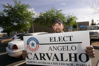North Las Vegas Ward 3 candidate Angelo Carvalho pauses for a photo as he greets voters Tuesday outside the Silver Mesa Community Center.
