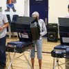 David Sweningsen joins his parents, Jean and Charles, in voting at Garrett Middle School in Boulder City. David Sweningsen joins his parents, Jean and Charles, in voting at Garrett Middle School in Boulder City.