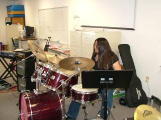 Camp director Heather Rampton provides some percussion tips at Girls Rock Vegas,  a Las Vegas summer camp that provides young girls with rock music instruction, promotes self expression and provides support.