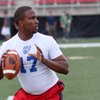 Photo: Brian Johnson, quarterback from Utah drops back to Photo: Brian Johnson, quarterback from Utah drops back to