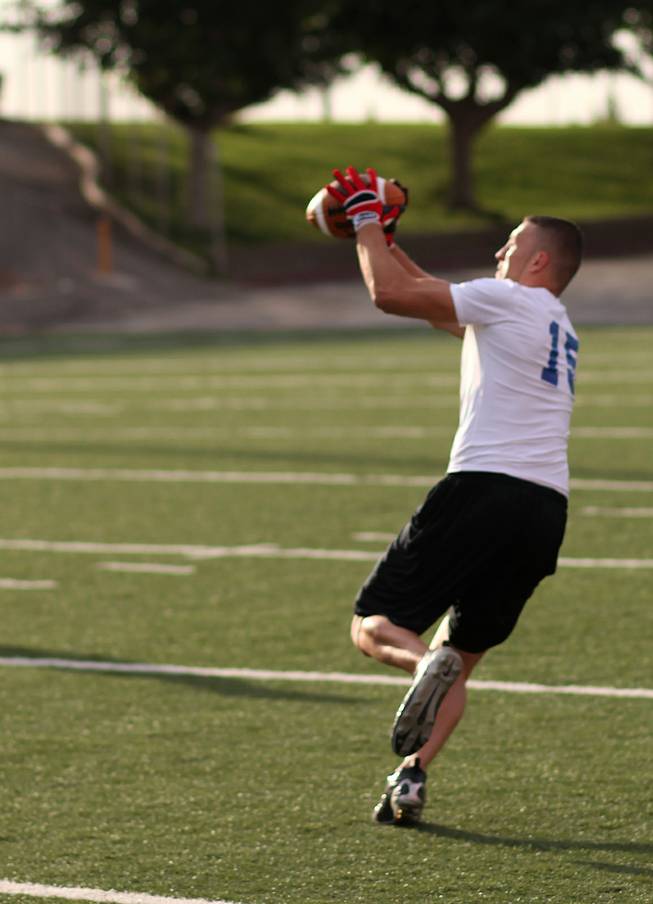 Casey Flair, former UNLV receiver, catches a pass during the UFL workouts at Sam Boyd Stadium Saturday. Las Vegas is one of four teams in the new football league and will have former New York Giant coach Jim Fassel leading the team.
