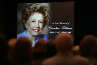 Friends and family gather in a ballroom at Harrah's during a memorial for Claudine Williams on Saturday.