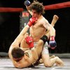 Clay Guida, top, rears back to punch Josh Thomson in their mixed martial arts fight during the Strikeforce event in San Jose, Calif., Friday, March 10, 2006. Guida won by decision. Guida will face Diego Sanchez in a UFC lightweight contest Saturday at the Pearl at the Palms.