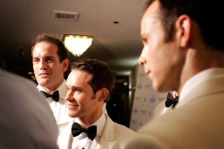 Toby Allen, from left, and Michael Tierney of Human Nature, an Australian group, do interviews on the red carpet before their show 