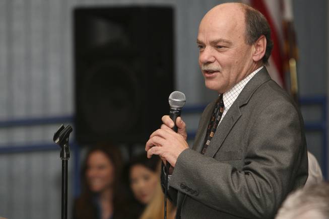 Nevada superintendent of public instruction Keith Rheault introduces surprise guest Michael Milken during an assembly at C.T. Sewell Elementary School in December. 