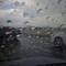 Photo: As raindrops bead up on a car windshield, Mandalay Photo: As raindrops bead up on a car windshield, Mandalay