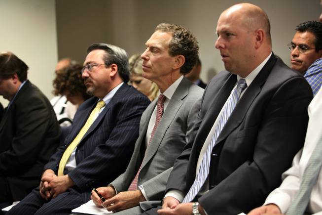 "The financial health of the company is good," said Michael Yackira, center, president and CEO of NV Energy, after a less-than-desired rate hike was approved.