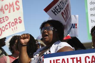 Tara Pruitt pumps her fist while chanting 