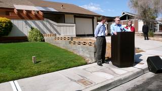 Senate Majority Leader Harry Reid (D-Nev.) speaks Wednesday at a press conference in a Las Vegas neighborhood, where U.S. Department of Housing and Urban Development Secretary Shaun Donovan, left, announced the expansion of President Obama's Home Affordable Refinance Program. U.S. Rep. Dina Titus (D-Nev.) is at right.