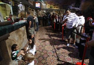 Fainga Tangitau, right, of Summerlin waits to register for a free room at Buffalo Bill's Primm . Many locals are taking advantage of the 