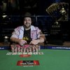 David Bach, the winner of the fourth annual World HORSE Championship event at the World Series of Poker, poses with the Chip Reese Trophy.