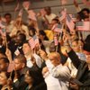 Newly sworn in U.S. citizens wave flags Thursday. U.S. Citizen and Immigration Services and the city of Las Vegas welcomed more than 100 Las Vegas-area residents as new citizens during a Thursday swearing-in ceremony at Las Vegas City Hall. Newly sworn in U.S. citizens wave flags Thursday. U.S. Citizen and Immigration Services and the city of Las Vegas welcomed more than 100 Las Vegas-area residents as new citizens during a Thursday swearing-in ceremony at Las Vegas City Hall.