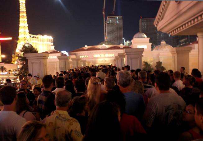 Fourth of July crowds pack the pedestrian bridge outside the Bellagio on the Las Vegas Strip in 2009.

