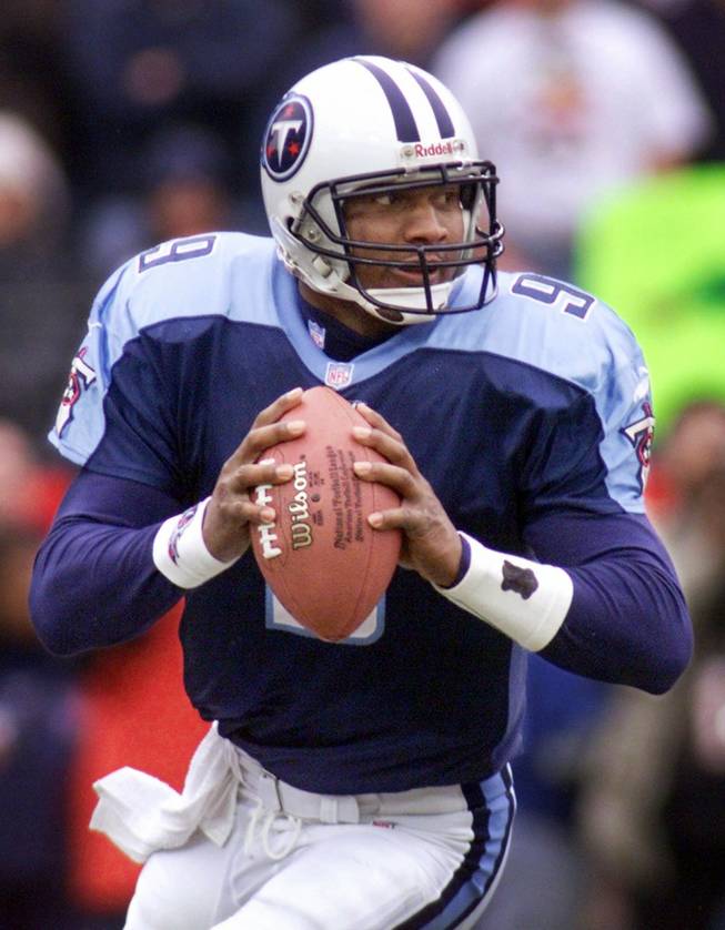 In this Jan. 8, 2000 file photo, Tennessee Titans quarterback Steve McNair looks for a receiver during the Titans' 22-16 wild card playoff win over the Buffalo Bills in Nashville, Tenn.  McNair has been shot and killed.  Tennessee Titans owner Bud Adams confirmed the quarterback's death in a brief statement released Saturday.