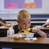 Kindergarten student Jeremy Smith, center, eats breakfast last week at Cortez Elementary School. The Clark County School Board on Thursday put off raising prices for most meals by 25 cents, but a request was made to add the item to the agenda for the board's next meeting. With the hike, Jeremy's breakfast would cost $1.25. Kindergarten student Jeremy Smith, center, eats breakfast last week at Cortez Elementary School. The Clark County School Board on Thursday put off raising prices for most meals by 25 cents, but a request was made to add the item to the agenda for the board's next meeting. With the hike, Jeremy's breakfast would cost $1.25.