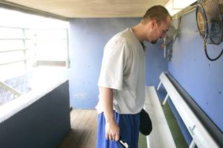 Las Vegas 51s catcher Kyle Phillips cools his head under a dugout mister during batting practice before a game against Tacoma on Thursday.