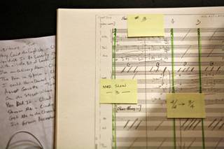 Nathan Tanouye looks at notes while leading the Las Vegas Jazz Connection in a rehearsal for 