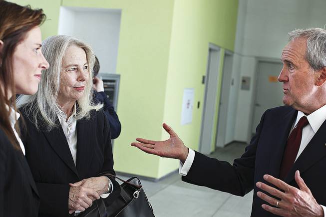 Libby Lumpkin, center, who has been hired to amass and curate the rotating art exhibit at the brain center, chats with Maureen Peckman, left, chief operating officer of Keep Memory Alive, the center's fundraising arm, and Larry Ruvo, the center's founder. Lumpkin was executive director of the Las Vegas Art Museum.
