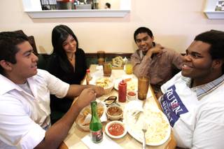 Kenneth Ortiz, from left, Perla Gomez, Francisco Morales and Joseph Hill talk during a watch party at Esmeralda's Cafe in Las Vegas to view the U.S. Senate voting on Judge Sonia Sotomayor's confirmation to the Supreme Court on Thursday.