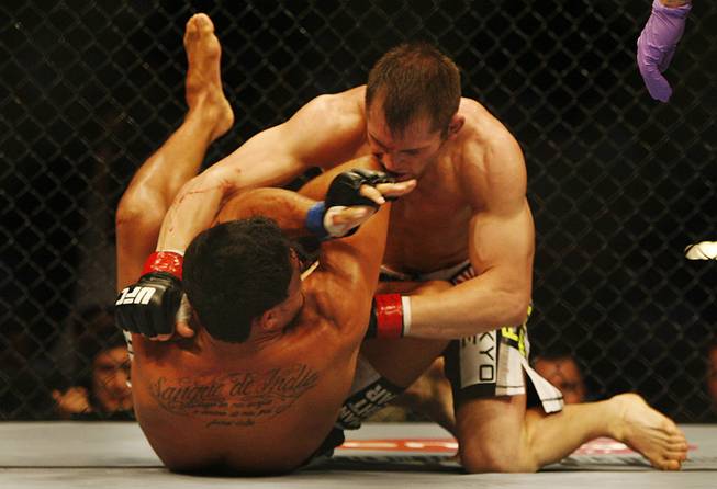 Fans of mixed martial arts and the UFC, Ultimate Fighting Championship gather at the Wachovia Center on Saturday evening August 8, 2009 for a night of fighting. Battle between welterweights Danillo Villefort and Jesse Lennox. Lennox is on top. This is the first fight of the night. Villefort lost.
