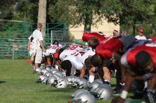 The Rebels warm up with a team stretch before the second of two Wednesday practices at Broadbent Park in Ely on Wednesday.