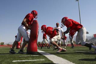 Arbor View High defensive back Marcus Williams, right, and tight end Bransen Rodriguez go through drills on Monday during practice at Arbor View High School.
