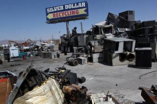 Residential and light commercial air conditioning units, at right, are seen waiting to be pieced-out for recycling at Silver Dollar Recycling in Las Vegas.