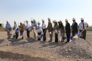 Henderson Libraries Executive Director Tom Fay, center, joins distinguished guests and contractors in breaking ground Tuesday, Aug. 18, 2009, on the 19,919-square-foot new James I. Gibson Library located at Lake Mead Parkway and Water Street.

