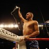 Juan Diaz of Houston holds up the NABO Junior Welterweight title belt after he defeated Paulie Malignaggi in a decision in 12 rounds on Aug. 22, 2009, in Houston.