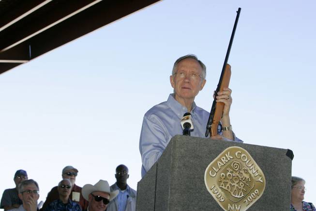 Senate Majority Leader Harry Reid (D-NV) holds up his childhood ...